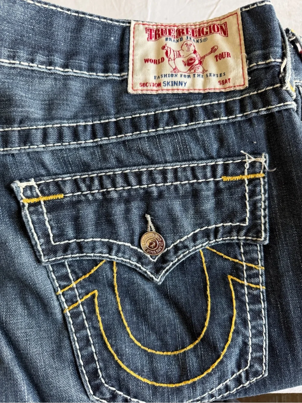 True Religion men’s street cut Jeans in Dark Indigo with Yellow Stitching